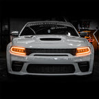 Front view of Dodge Charger with Alpha Black NOVA Series projector headlights glowing amber