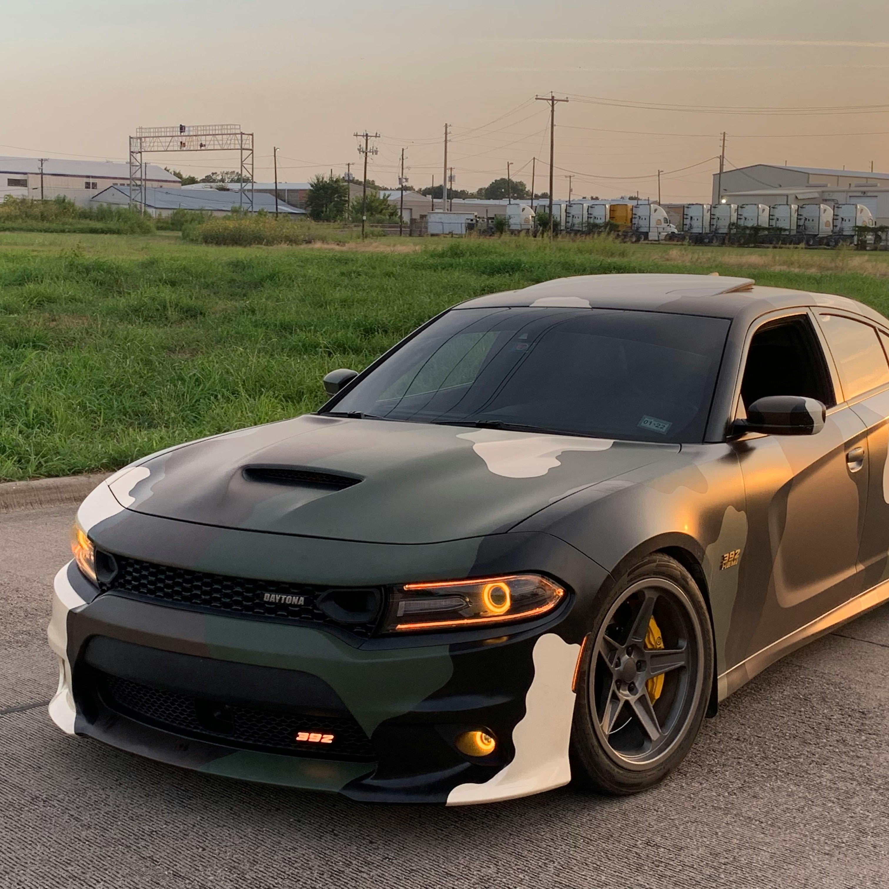 2011–2023 Dodge Charger with multicolor LED halo headlights and camo wrap